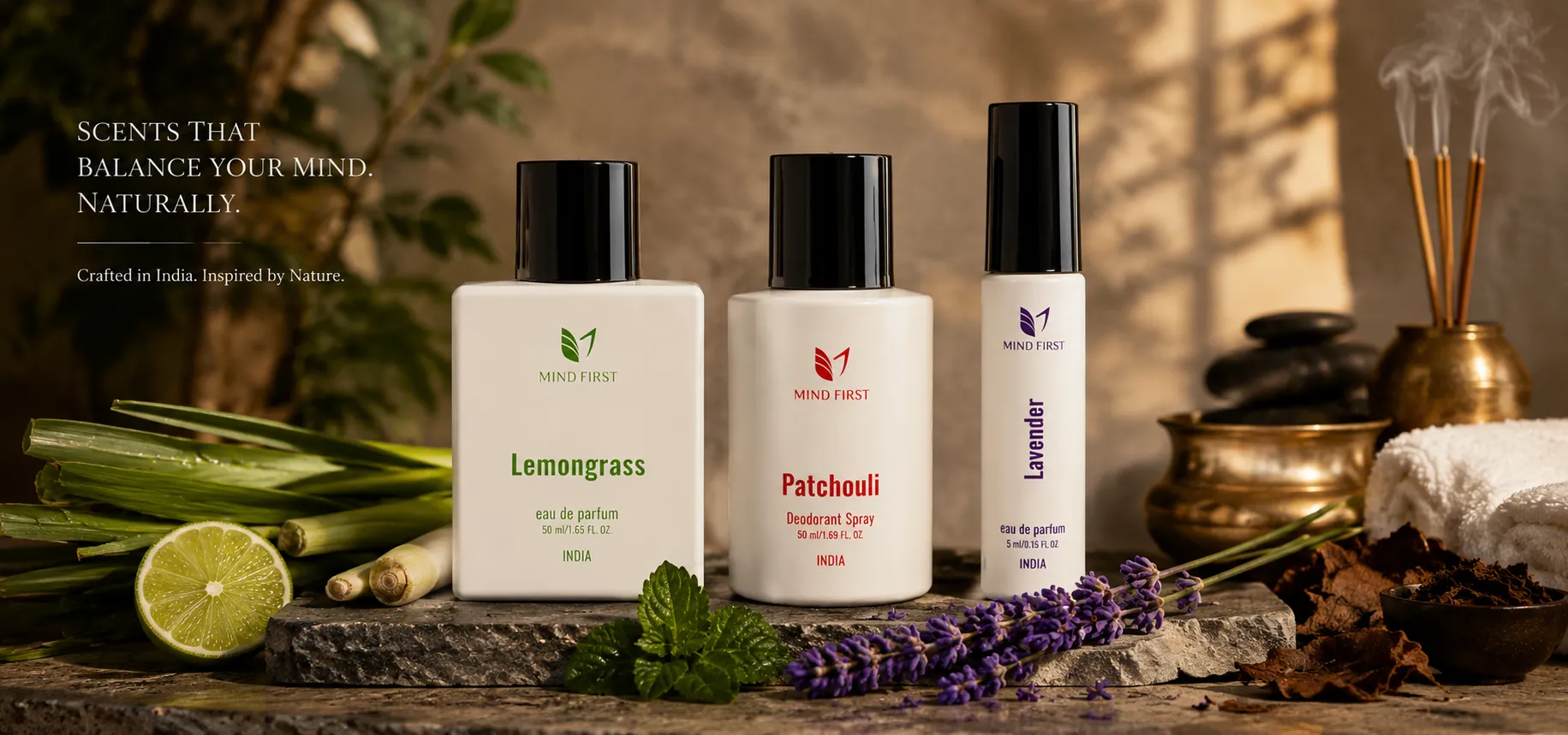 Mind First scented products (Lemongrass, Patchouli, Lavender) displayed on a stone surface with lime and lavender, promoting natural balance.