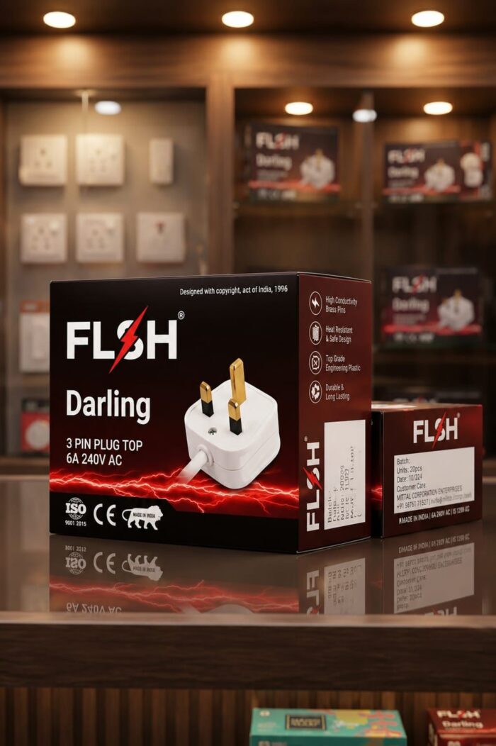 Boxed Flash Darling 3‑pin plug adapter (6A 240V AC) on a reflective surface in a store display, with a red lightning graphic in the design.