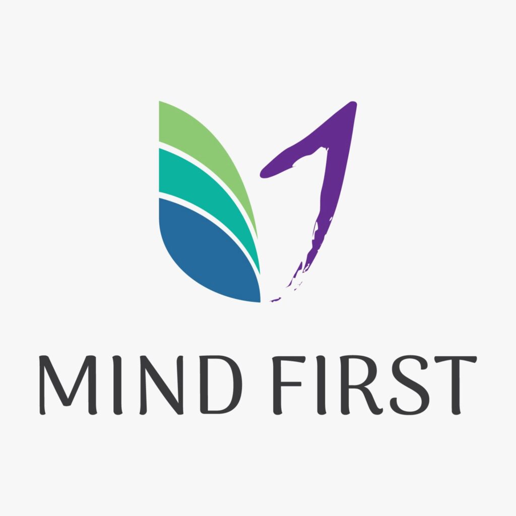 Logo with a multicolored butterfly wing and a purple quill forming an 'M', accompanied by the text 'MIND FIRST'