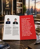 Open magazine on a bar counter showing two headshots on the left and a red article page on the right with white text, city skyline in the background.